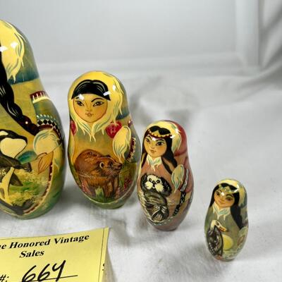 Five hand painted one of a kind Russian nesting dolls, signed