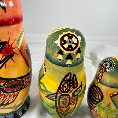 Five hand painted one of a kind Russian nesting dolls, signed