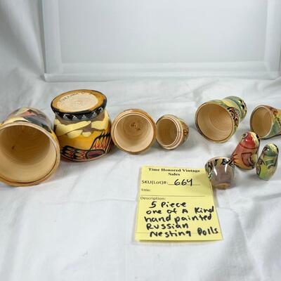 Five hand painted one of a kind Russian nesting dolls, signed