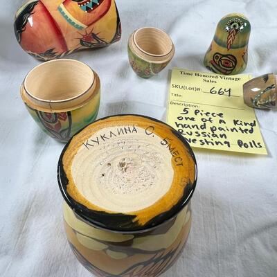 Five hand painted one of a kind Russian nesting dolls, signed