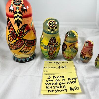 Five hand painted one of a kind Russian nesting dolls, signed