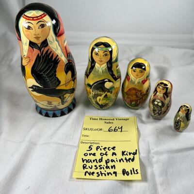 Five hand painted one of a kind Russian nesting dolls, signed