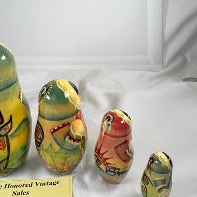 Five hand painted one of a kind Russian nesting dolls, signed
