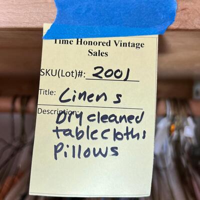 Linens, tablecloths, many pillows