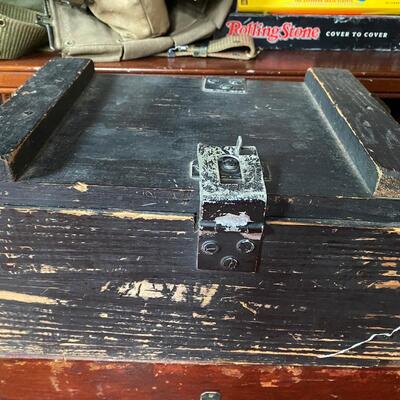 Old wooden ammo box with rope handles, lockable clasp