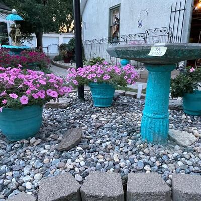 P14- Four piece lot, bird bath, three planters with flowers