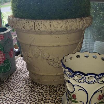 2 pots, a watering can and a topiary
