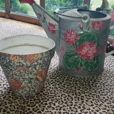2 pots, a watering can and a topiary