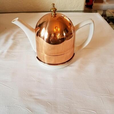 Solid copper tea pot cozy with ceramic teapot