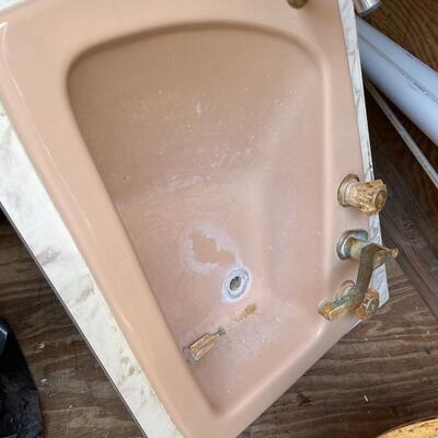Vintage cast iron dusty pink bathroom sink with hose