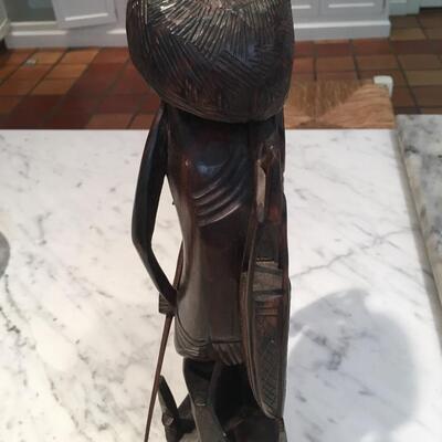 Carved wood statue of man