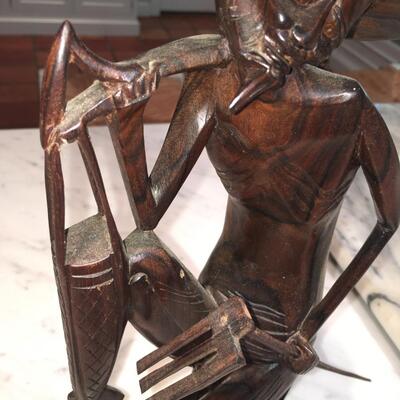 Carved wood statue of man