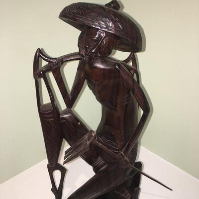 Carved wood statue of man