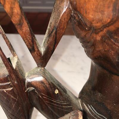 Carved wood statue of man