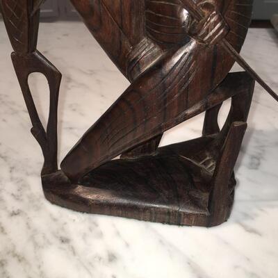 Carved wood statue of man