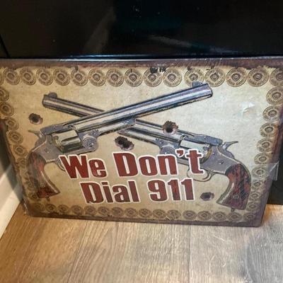 RIVERS EDGE TIN SIGN "WE DON'T DIAL 911" 12"x17"