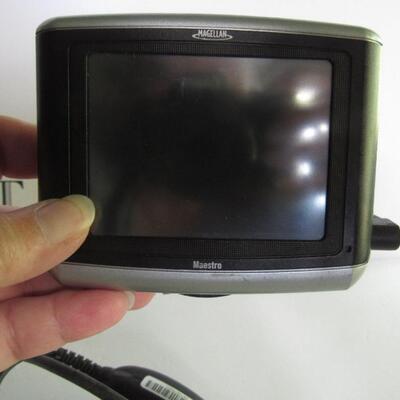Older Magellan GPS With Car Cigarette Plug In and Partial Mount