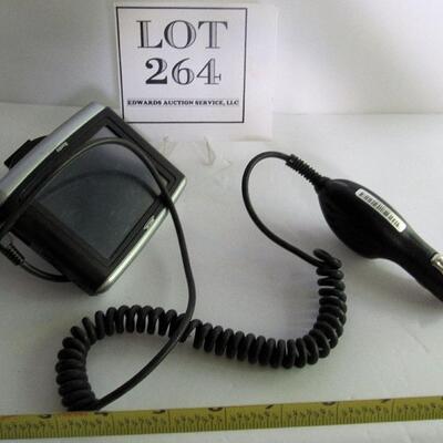 Older Magellan GPS With Car Cigarette Plug In and Partial Mount