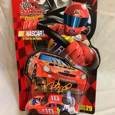 3 NASCAR items - 2 cars and 1 Starting Lineup Figure 4.5â€ tall approx