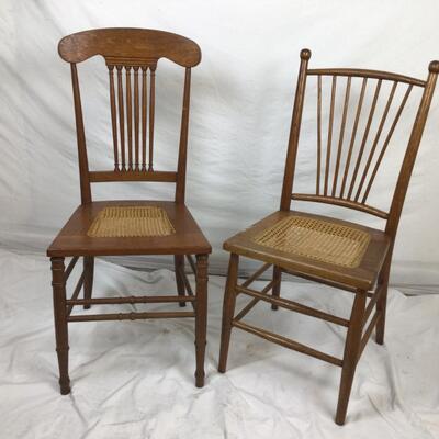 Lot. 5403. Two Vintage Oak Spindle Back Cane Chairs