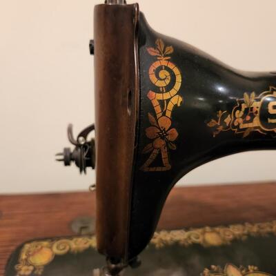 LOT 137RP: Antique Oak Cabinet Singer Sewing Treadle Machine