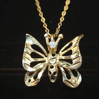 14 k Gold   and diamind necklace butterfly necklace 22 in