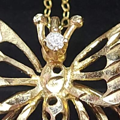 14 k Gold   and diamind necklace butterfly necklace 22 in