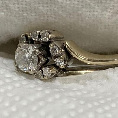 14 k Gold and diamind ring size  7 1 ct total  7 g 14 k