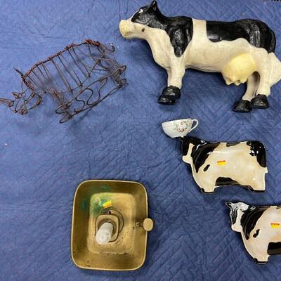 Metal rhino, metal painted cow and small tea cup