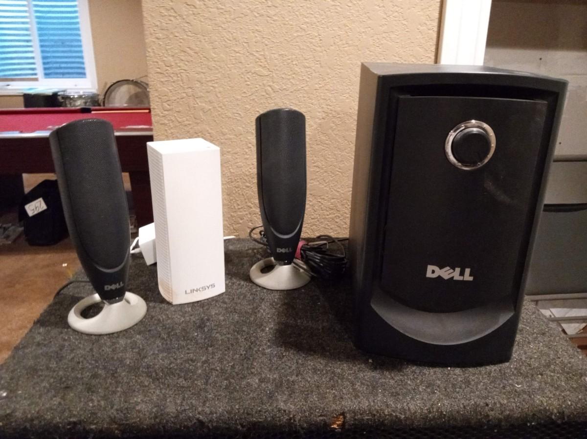 LOT 303 DELL SPEAKERS AND LINKSYS MODEM