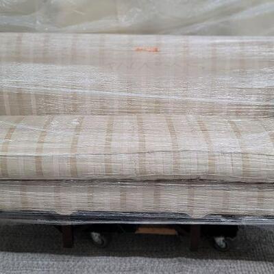 Cream and tan leather stripe settee 