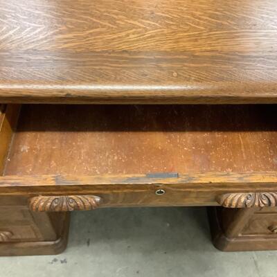 Lot. 5505. Vintage Nine Drawer Oak Desk