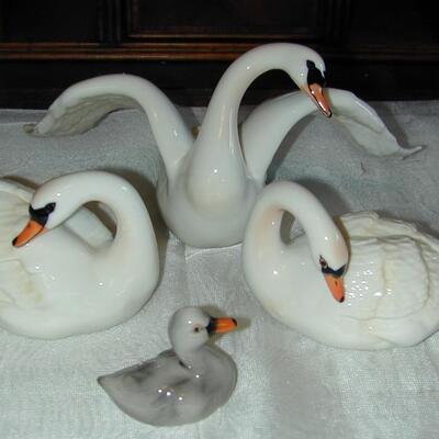 4 Signed Porcelain Swan Figurines
