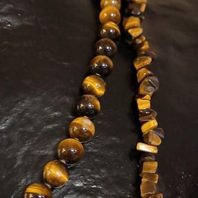 Lot 103: Tiger's Eye Necklaces - (1) with a 14k Gold Clasp