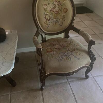 Low sitting antique chair