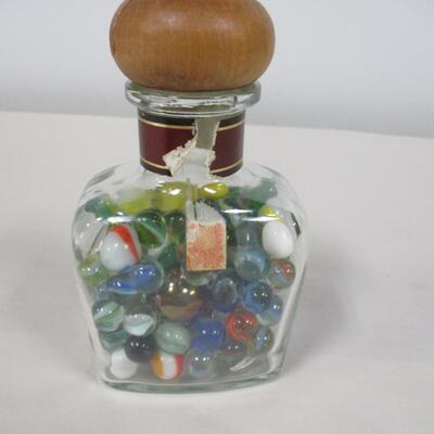 Collection Of Marbles In A Bottle