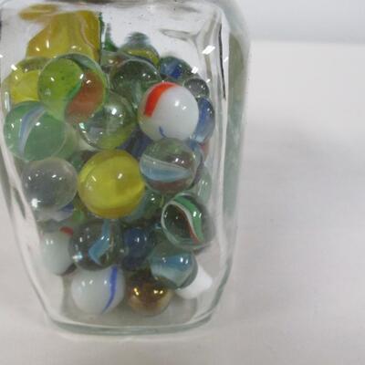Collection Of Marbles In A Bottle