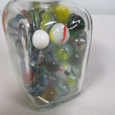 Collection Of Marbles In A Bottle