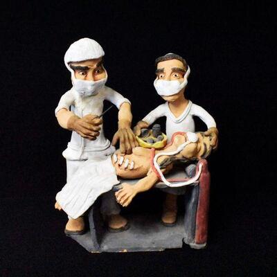 Surgeon Stitching Up a Woman 