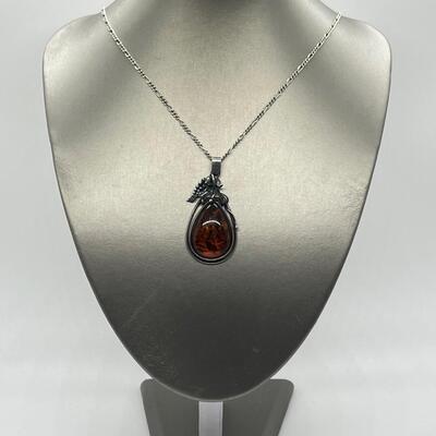 LOT 6: Sterling Silver and Amber Pendant on 30