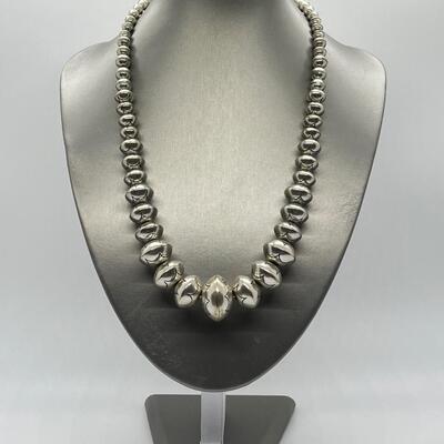 LOT 21: 22-inch Strand of Sterling Silver Graduated "Navajo Pearls" - 75 grams total weight
