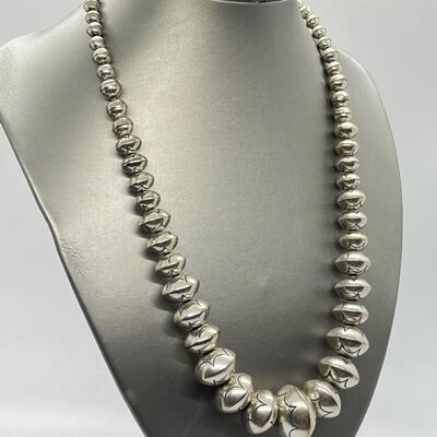 LOT 21: 22-inch Strand of Sterling Silver Graduated "Navajo Pearls" - 75 grams total weight