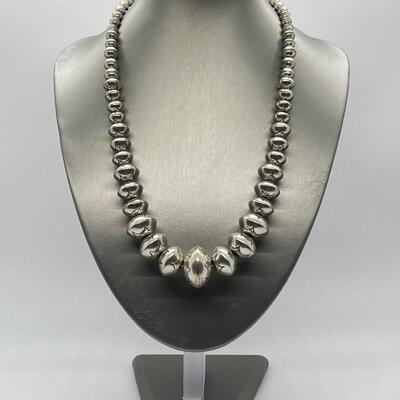 LOT 21: 22-inch Strand of Sterling Silver Graduated "Navajo Pearls" - 75 grams total weight