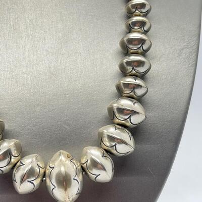 LOT 21: 22-inch Strand of Sterling Silver Graduated "Navajo Pearls" - 75 grams total weight