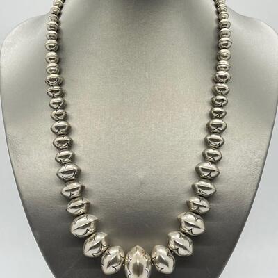 LOT 21: 22-inch Strand of Sterling Silver Graduated "Navajo Pearls" - 75 grams total weight