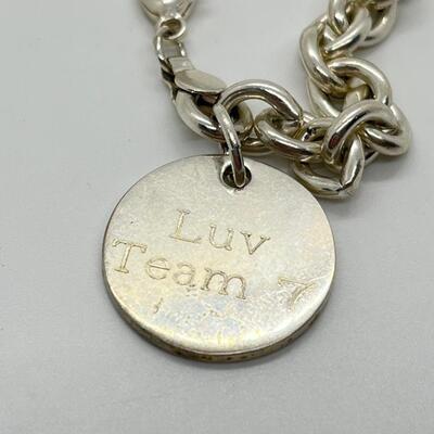 LOT 26: Sterling Silver Charm Bracelet - 30.1 Grams total weight