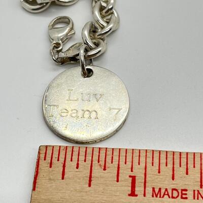 LOT 26: Sterling Silver Charm Bracelet - 30.1 Grams total weight