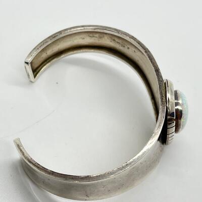 LOT 27: Signed Delvin John Sterling Silver Navajo Cuff Bracelet with Large Opal Teardrop - 26.3 Grams total weight