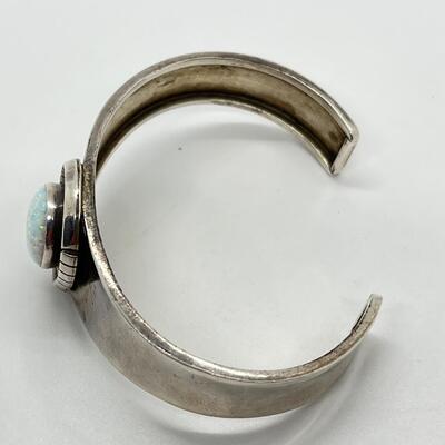 LOT 27: Signed Delvin John Sterling Silver Navajo Cuff Bracelet with Large Opal Teardrop - 26.3 Grams total weight