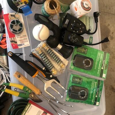 G65- Ext cords, timers, yard items w/tote